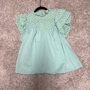 Women’s short ruffle sleeve top.
